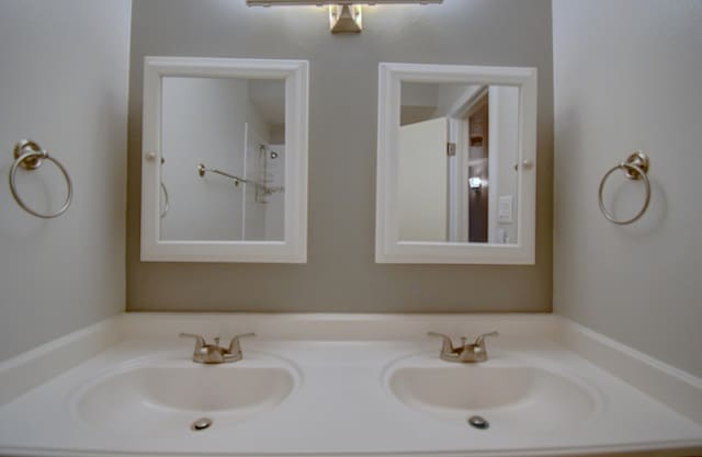bathroom featuring double vanity and a sink