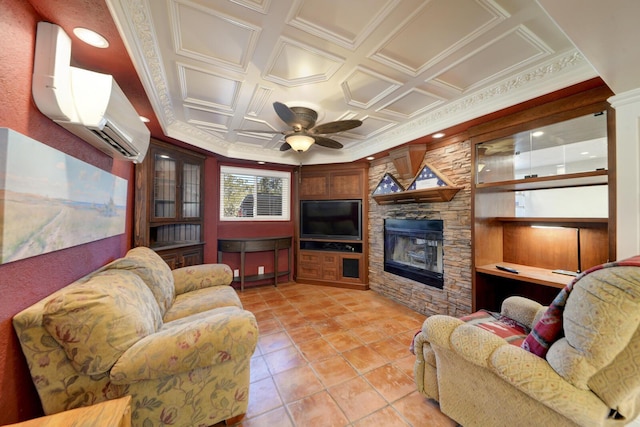 living room with crown molding, an AC wall unit, a stone fireplace, and ceiling fan