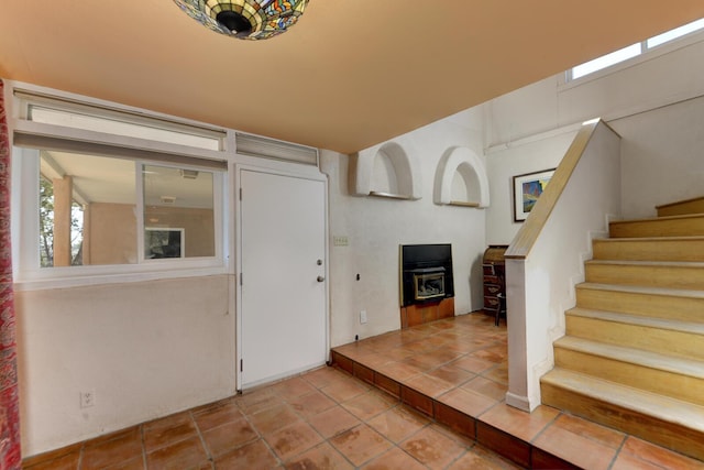tiled foyer entrance featuring stairway