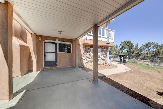 view of patio / terrace featuring fence