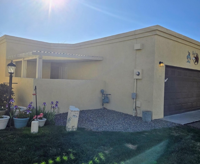 3404 Esplanade Pl SE, Rio Rancho, NM 87124 - view of home's exterior featuring a garage and stucco siding