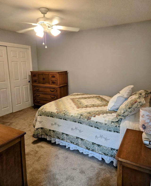 3404 Esplanade Pl SE, Rio Rancho, NM 87124 - bedroom featuring carpet, a closet, and a ceiling fan