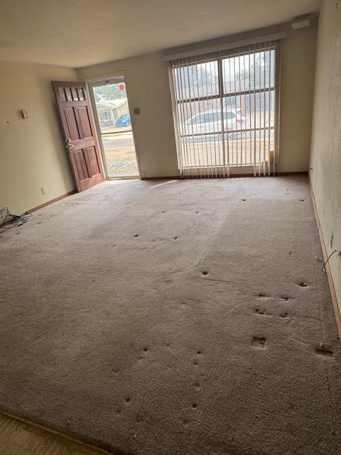 10509 San Jacinto Ave NE, Albuquerque, NM 87112 - unfurnished room featuring carpet