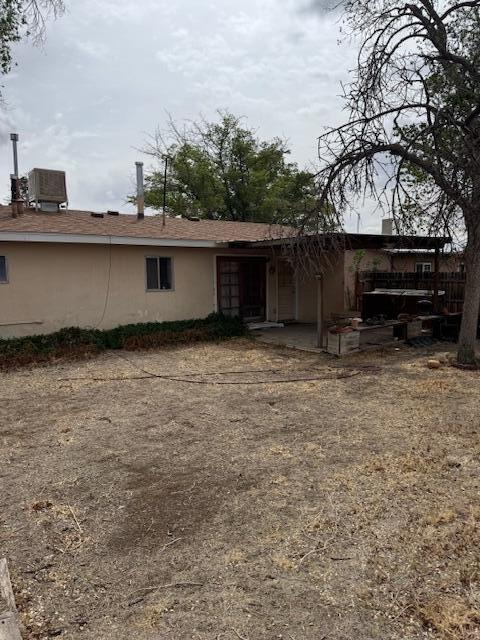 10509 San Jacinto Ave NE, Albuquerque, NM 87112 - rear view of property with stucco siding