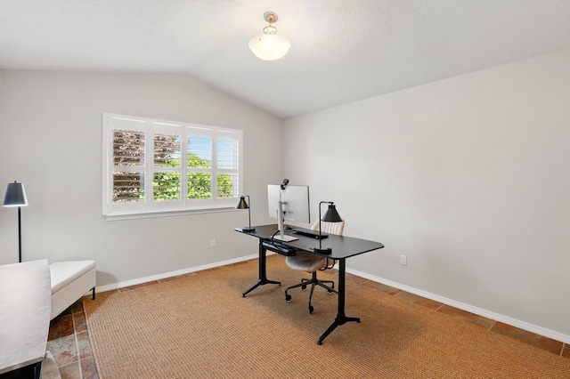 office area with vaulted ceiling and baseboards