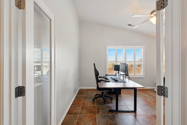 home office featuring lofted ceiling, visible vents, plenty of natural light, and a ceiling fan