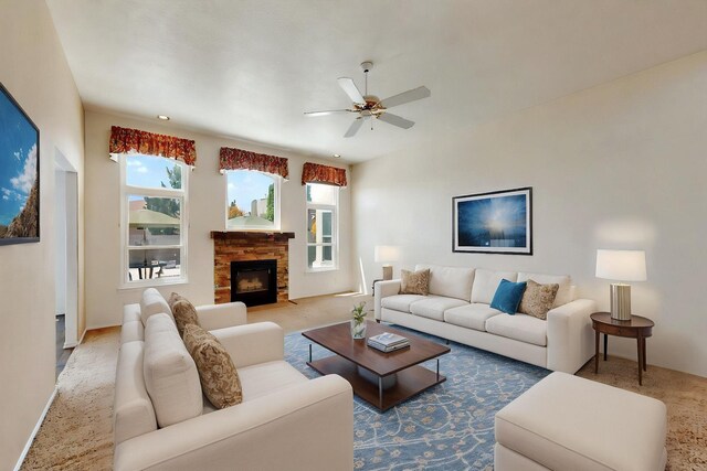 4532 Habershaw Rd NW, Albuquerque, NM 87120 - carpeted living area with a ceiling fan, a stone fireplace, and baseboards