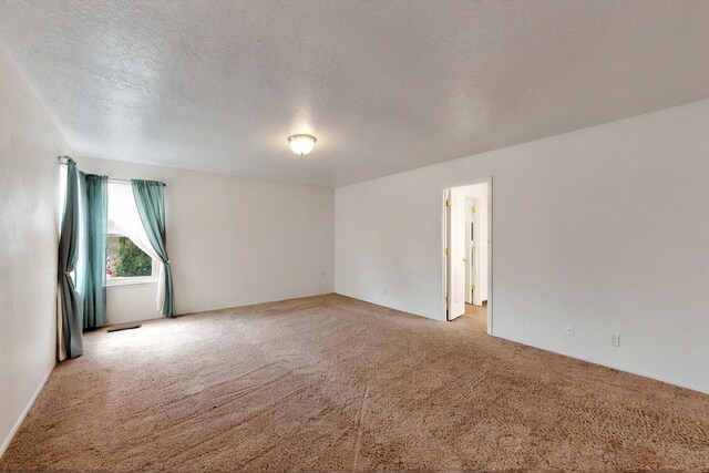 4532 Habershaw Rd NW, Albuquerque, NM 87120 - empty room featuring light colored carpet and a textured ceiling