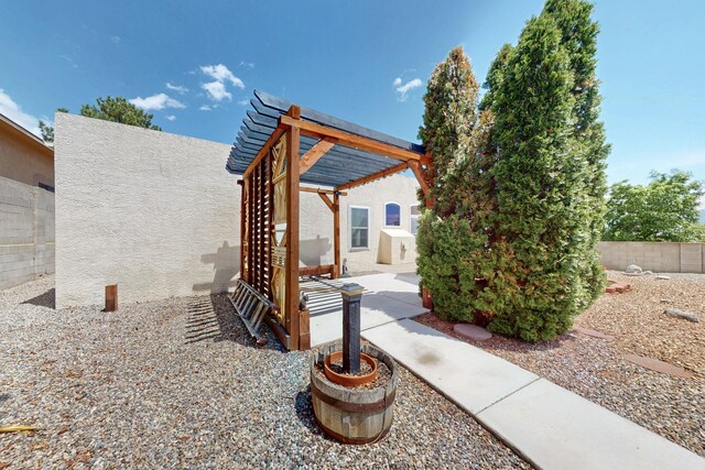 4532 Habershaw Rd NW, Albuquerque, NM 87120 - view of patio / terrace with fence and a pergola