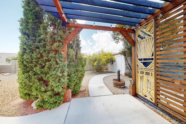 4532 Habershaw Rd NW, Albuquerque, NM 87120 - view of patio featuring a pergola and a fenced backyard