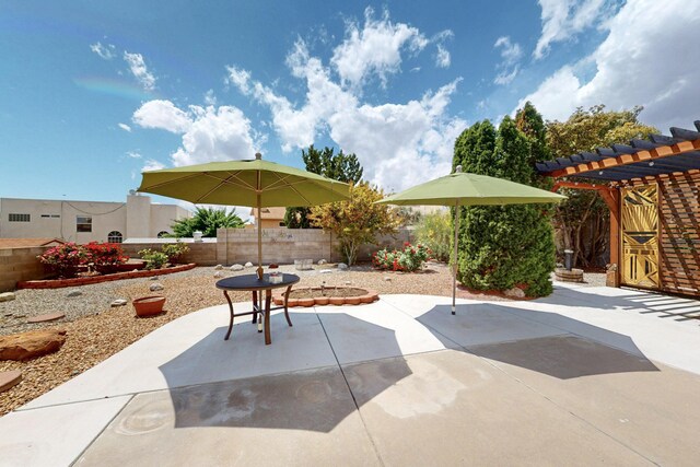 4532 Habershaw Rd NW, Albuquerque, NM 87120 - view of patio featuring a pergola and a fenced backyard