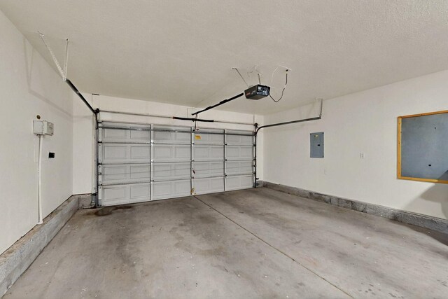 4532 Habershaw Rd NW, Albuquerque, NM 87120 - garage with a garage door opener, electric panel, and baseboards