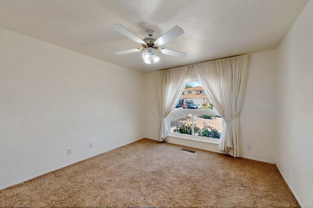 4532 Habershaw Rd NW, Albuquerque, NM 87120 - carpeted empty room featuring ceiling fan and baseboards