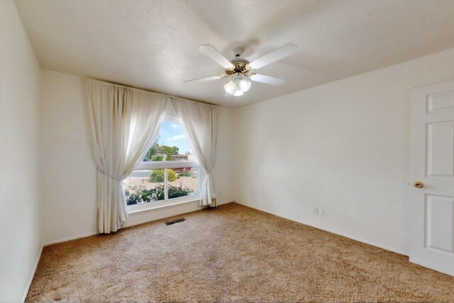 4532 Habershaw Rd NW, Albuquerque, NM 87120 - carpeted spare room featuring a ceiling fan and baseboards