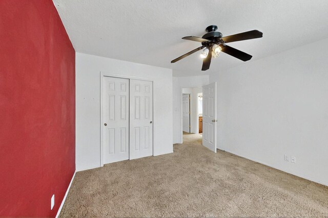 4532 Habershaw Rd NW, Albuquerque, NM 87120 - unfurnished bedroom featuring carpet flooring, a closet, and ceiling fan