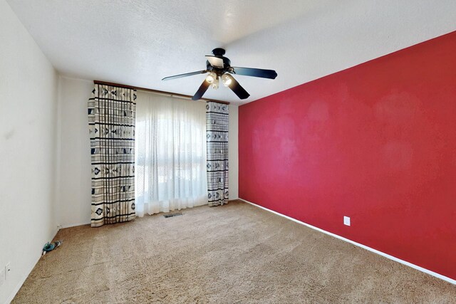 4532 Habershaw Rd NW, Albuquerque, NM 87120 - empty room featuring a ceiling fan, carpet flooring, and baseboards