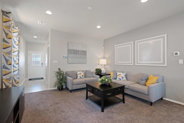 living room with light colored carpet, baseboards, and recessed lighting