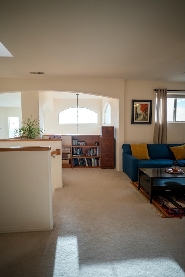 carpeted living area with visible vents