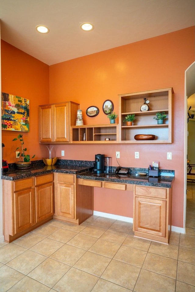 kitchen with dark stone counters, light tile patterned floors, open shelves, and recessed lighting