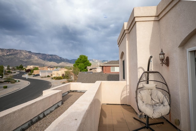 balcony with a residential view and a mountain view