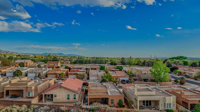 drone / aerial view featuring a mountain view and a residential view