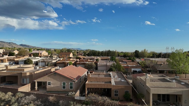 bird's eye view with a residential view and a mountain view