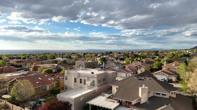 birds eye view of property with a residential view