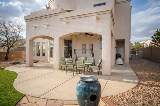 view of patio with ceiling fan, fence private yard, and outdoor dining area