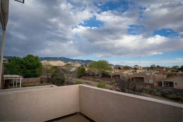 balcony with a mountain view and a residential view