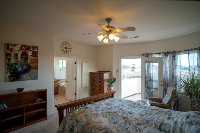 bedroom with connected bathroom, light colored carpet, ceiling fan, visible vents, and access to exterior