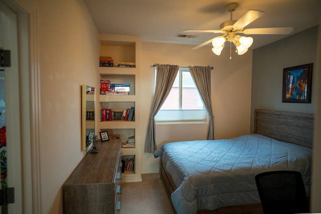 carpeted bedroom featuring a ceiling fan and visible vents
