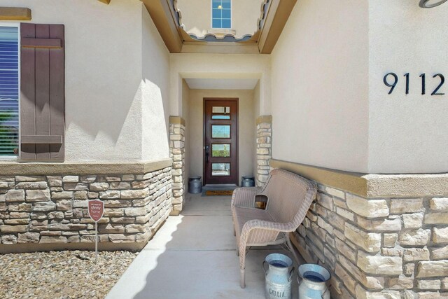 9112 Lansdowne Pl NE, Albuquerque, NM 87113 - entrance to property featuring stone siding and stucco siding