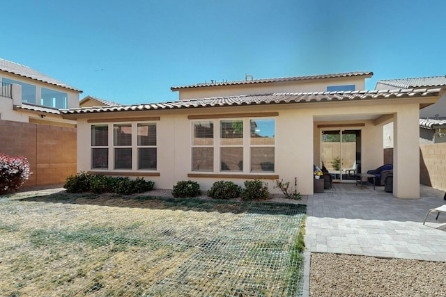9112 Lansdowne Pl NE, Albuquerque, NM 87113 - back of house with stucco siding and a patio