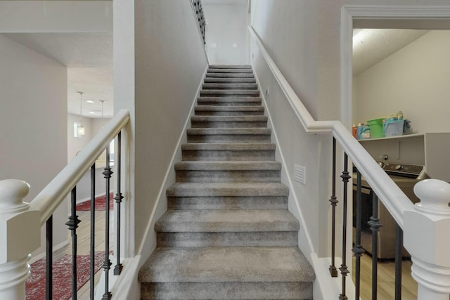 stairway featuring baseboards