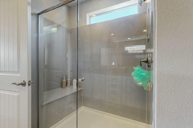9112 Lansdowne Pl NE, Albuquerque, NM 87113 - full bath featuring a shower stall and a textured wall