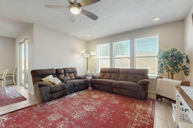 9112 Lansdowne Pl NE, Albuquerque, NM 87113 - living area with a ceiling fan, a textured ceiling, light wood-style floors, and recessed lighting