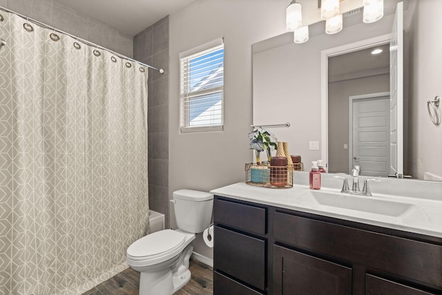 bathroom featuring shower / bathtub combination with curtain, wood finished floors, vanity, and toilet