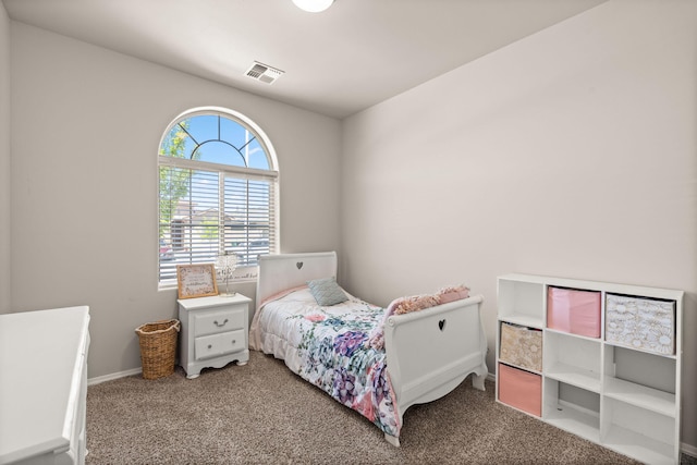 bedroom featuring baseboards, visible vents, and carpet flooring