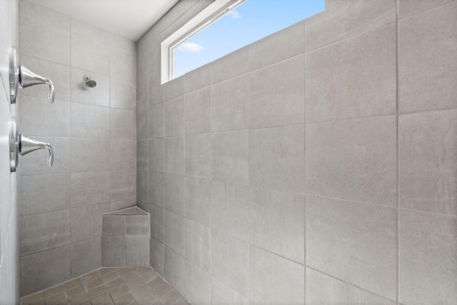 full bathroom with tiled shower
