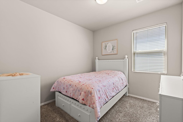 bedroom with carpet and baseboards