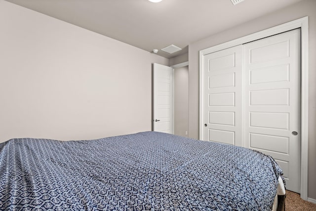 carpeted bedroom with a closet