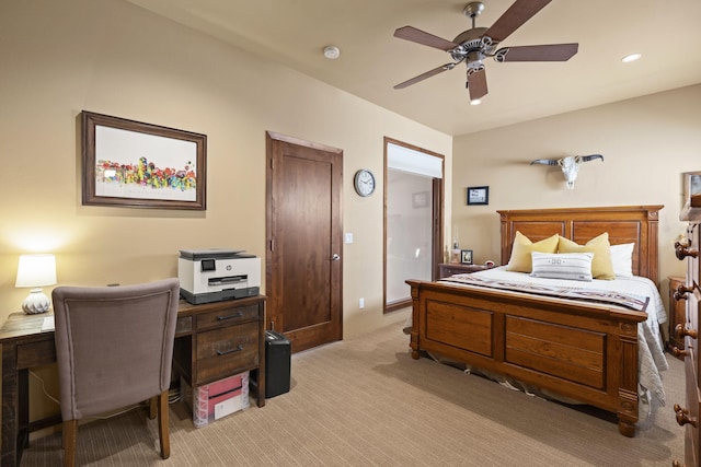 bedroom featuring light colored carpet and a ceiling fan
