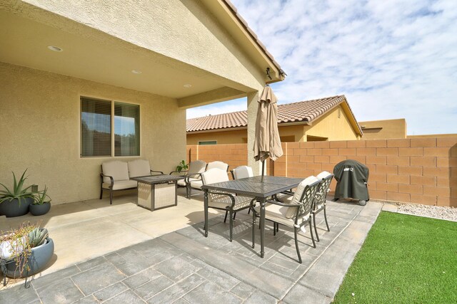 6952 Napoleon Rd NE, Rio Rancho, NM 87144 - view of patio with fence, outdoor lounge area, and outdoor dining space