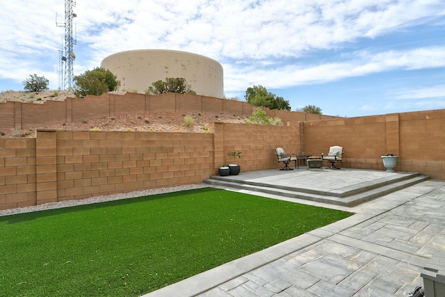 6952 Napoleon Rd NE, Rio Rancho, NM 87144 - view of yard with a fenced backyard and a patio