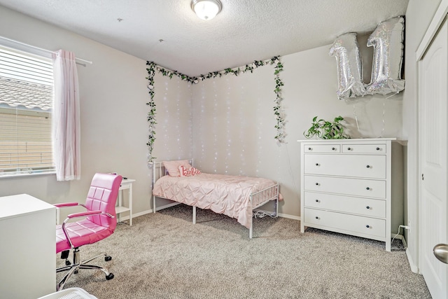 6952 Napoleon Rd NE, Rio Rancho, NM 87144 - bedroom with baseboards, light carpet, and a textured ceiling
