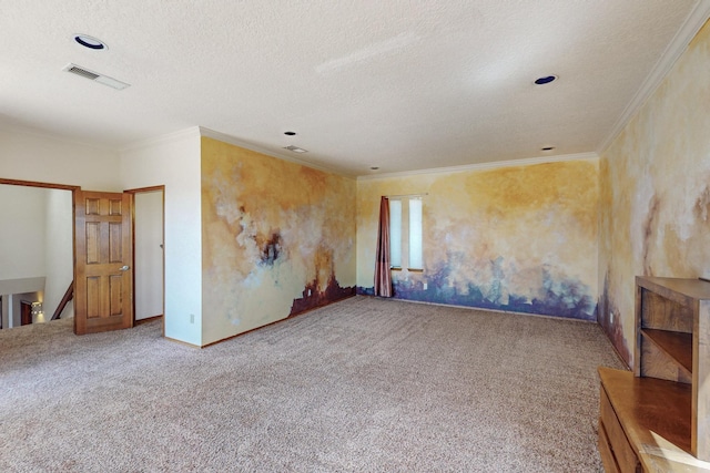 unfurnished room with carpet flooring, baseboards, visible vents, a textured ceiling, and crown molding