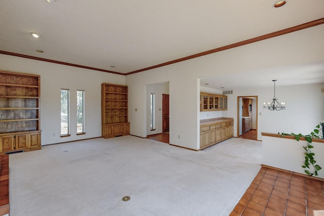 unfurnished living room featuring ornamental molding, recessed lighting, an inviting chandelier, and visible vents