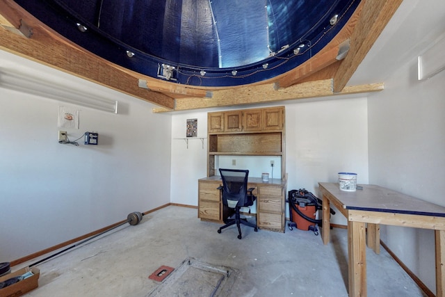 office area with concrete flooring and baseboards
