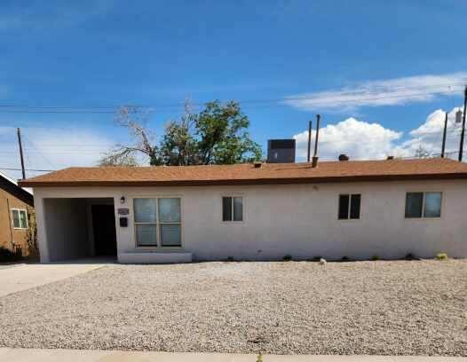 back of property featuring stucco siding