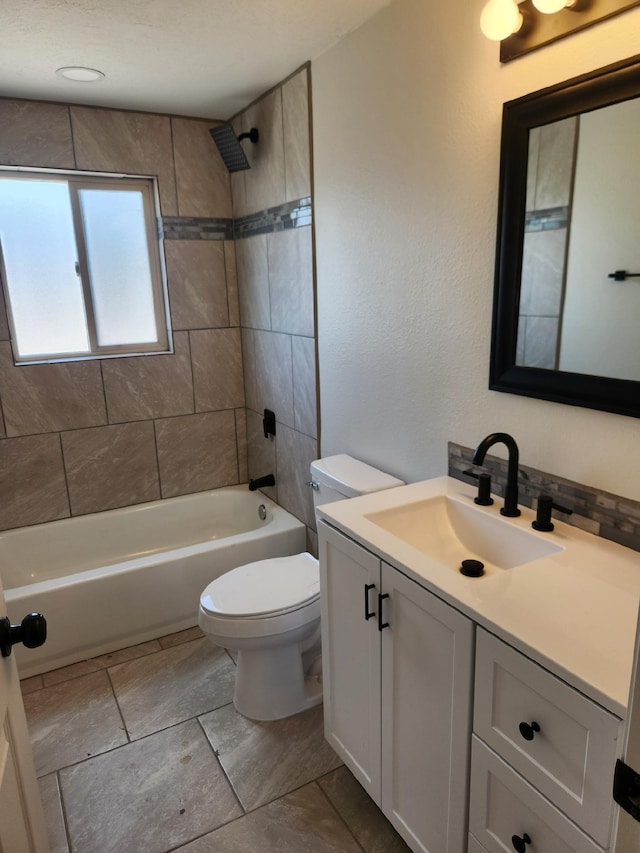 bathroom featuring vanity, toilet, and tub / shower combination